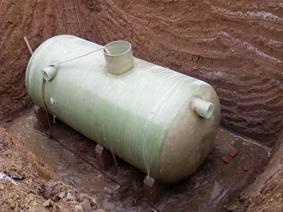 A FRP septic tank is installed underground.
