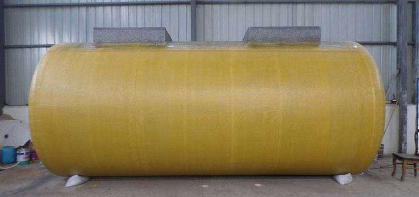 There is a double-wall FRP oil storage tank with yellow coated.
